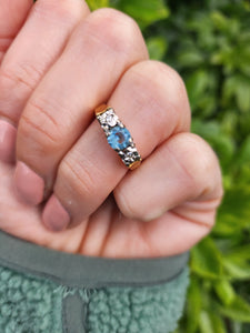 8295: Vintage: 18ct Gold Blue Aquamarine Twin Diamonds Dress Ring- date mark 1973