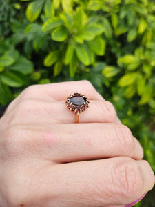 0771;Vintage: 9ct Gold 17 Rich Red Garnets Flower Head Ring- mature hues,