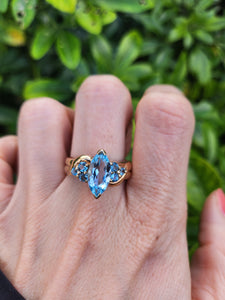 0377: Vintage; Statement 9ct Gold  7 Swiss Blue Topaz Cocktail Ring-