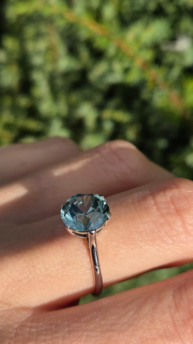 2191 Platinum Round Faceted Cut Blue Zircon Single Stone Ring