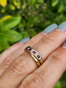 1663: Vintage: 9ct Gold Rubies Diamonds Crossover Ring- classic design.