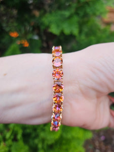 0146: Vintage: 9ct Gold 24 Mystic Topaz Statement Bracelet (19cm) - a festival of colours