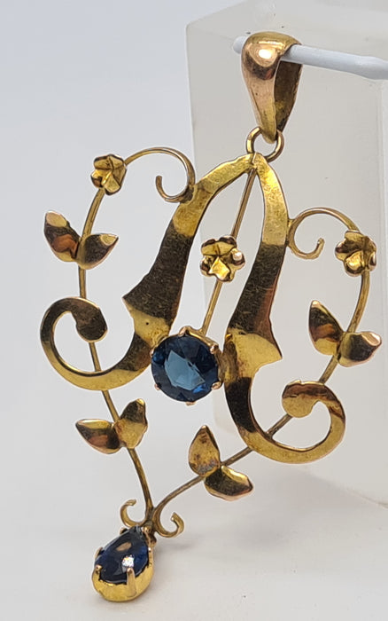 4823: Colgante de solapa de zafiros azules sintéticos de oro antiguo y antiguo de 9 quilates, simetría encantadora